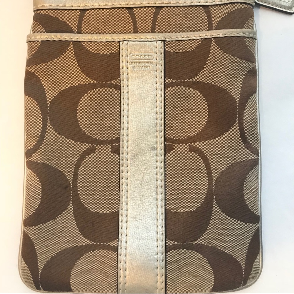 Used- Coach khaki and brown C cross over bag
